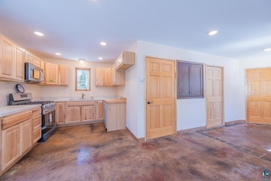 Kitchen with stainless steel appliances, sink, and