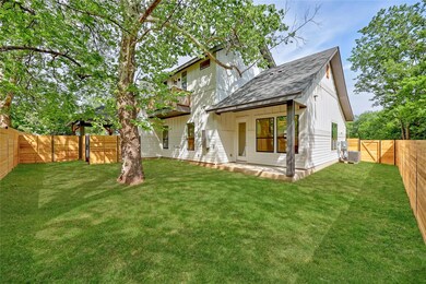 Back of property with a lawn, central air conditi