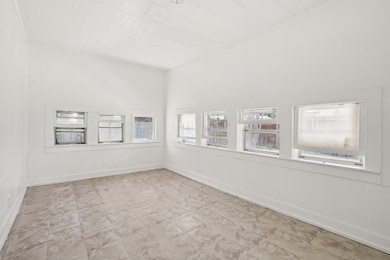 Empty room featuring baseboards