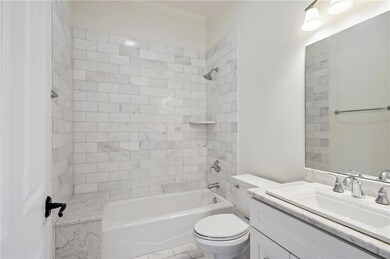 Representative photo -Upstairs marble bathroom