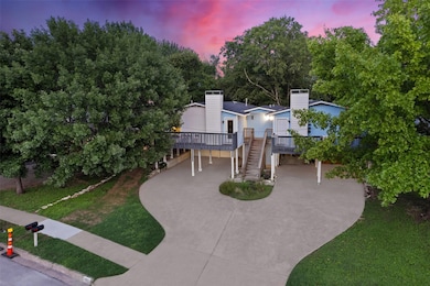 View of front of house featuring a carport, drive