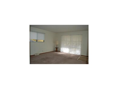 Living Room. New carpet, new shades, new curtains,