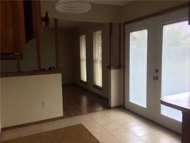 Newer French Door Leads to Open Patio And Nice Bac