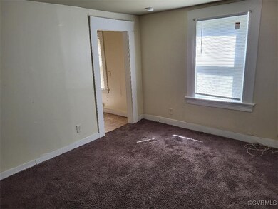 Empty room featuring carpet floors