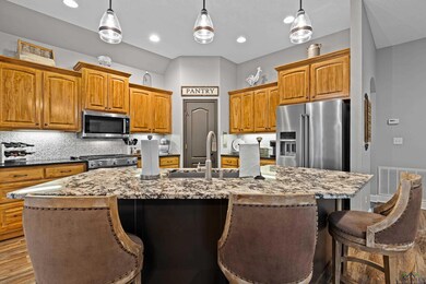 Kitchen featuring high end appliances, pendant lig