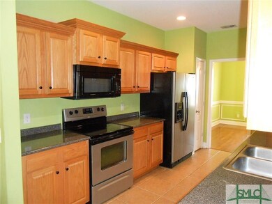 Kitchen with smooth top stove, built in micro-wave