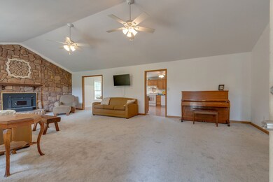 Great room 29x17 with a stone fireplace.  The fireplace is woodburning.  The new carpet has been installed in September 2020.