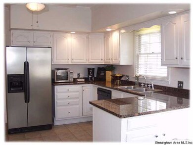 Spacious eat-in kitchen with ample cabinet and cou