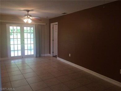 As you enter, the large dining area (with plenty of space for and office/computer area!) features tile flooring, ceiling fan and French doors to the lanai.