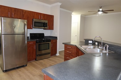 Kitchen with stainless steel appliances, a sink, 
