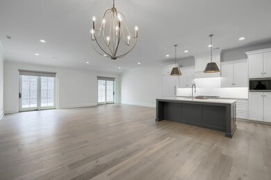 Engineered hardwood flooring, designer fixtures, Pella Doors, custom shades & Chef's kitchen.
