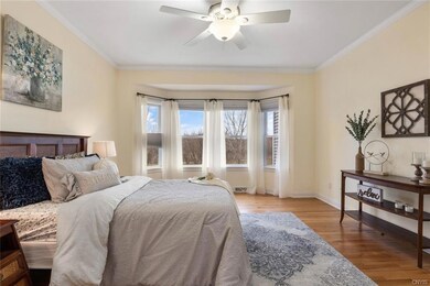 Large primary suite with crown molding