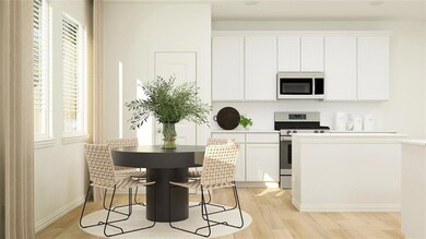 Kitchen featuring white cabinets, a healthy amount