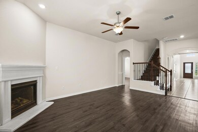 Unfurnished living room with arched walkways, rec