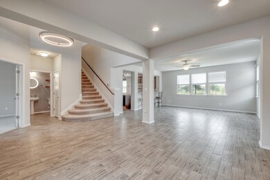Unfurnished living room featuring light wood fini
