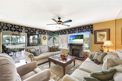 Tiled living room with a brick fireplace and a cei
