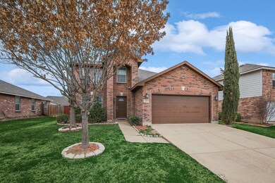 View of front property featuring a garage and a fr