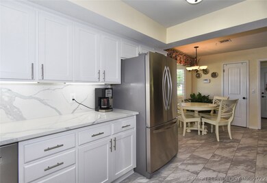 New flooring in kitchen and dining.  Refrigerator