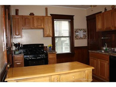 Kitchen. Kitchen features hardwood floors and cabi