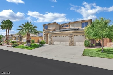 View of front facade with driveway, solar panels,