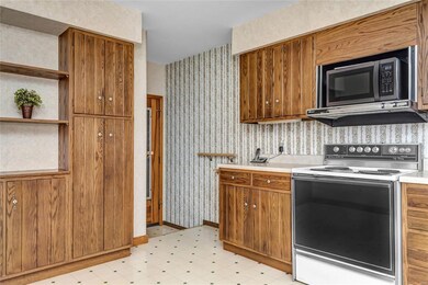 Kitchen cabinets provide plenty of storage space.
