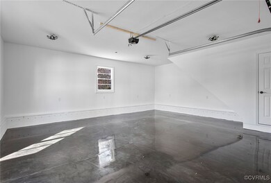 Newly drywalled garage w/ new epoxy floor, new gar