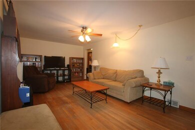 LIVING ROOM: LOOKING TOWARDS THE KITCHEN AND BEDRO