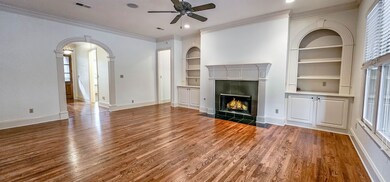 Highlighted by gas log fireplace accented by custo