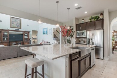 Kitchen has granite counter tops and breakfast bar