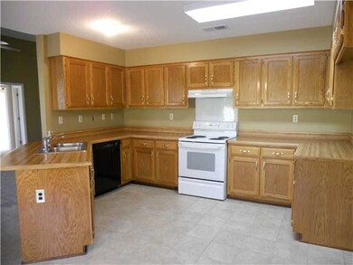 New ceramic tile, vinyl tiles under sink and in cabinets makes cleaning easy, florescent lighting, lots of cabinets and counter space.