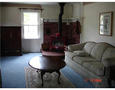 Living Room. Beautiful living area is warmed be ga