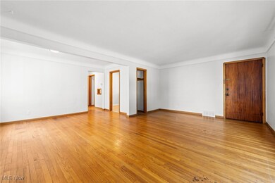 Living room with light wood-type flooring