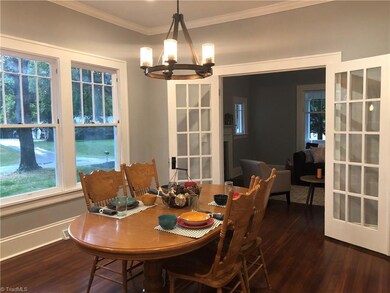 Kitchen opens up to large dining room then continues on to living room.