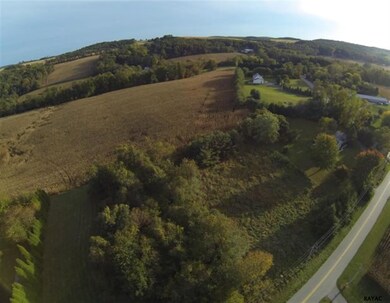 The lot is surrounded by rural setting with severa