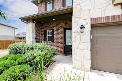 Doorway to property featuring stone siding and br