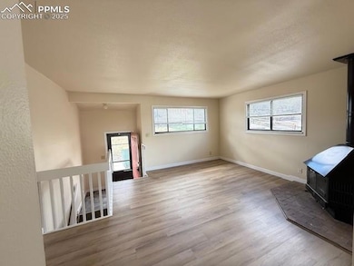 Unfurnished living room with a textured ceiling, w