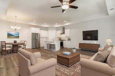 Living room featuring sink, dark hardwood / wood-s