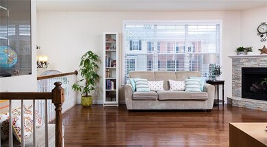 Hardwood floors, large windows, tiled gas fireplac