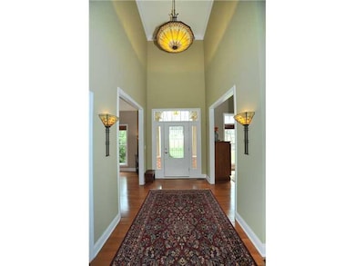 Entry/Foyer. The dramatic two-story entry is illum