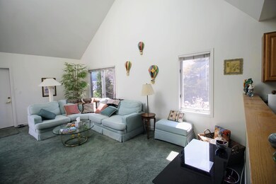living room w door to attached garage