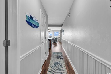 Hall with dark wood-type flooring
