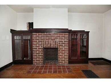 Living Room. Built in wooden cabinets give charact