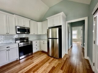 Enter from door at right, with hallway to bathroom