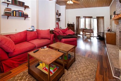 Large living room with laminate flooring.