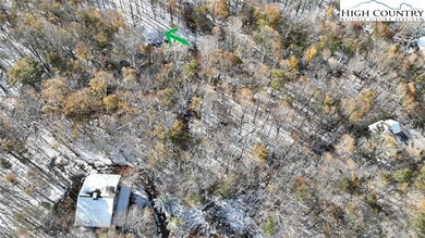Green arrow indicates location of old home site