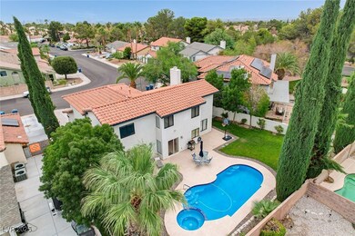 Aerial view of residential area featuring a pool