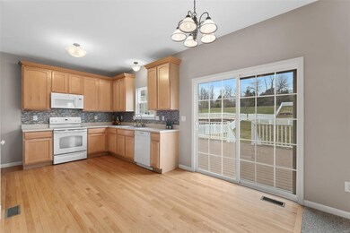 Sliding glass door leads to large 18x14 composite 