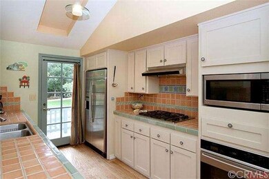 Efficient galley kitchen with patio door