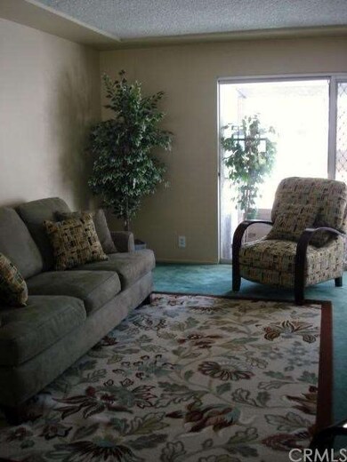 Living room that opens to dining room and has a sl