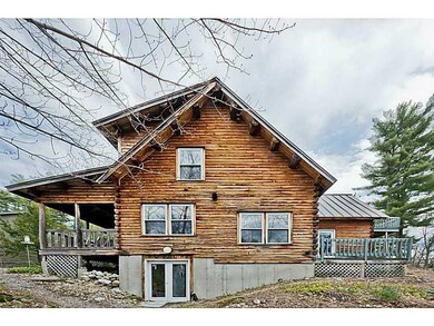 Exterior. Classic Maine Log Cabin on...
